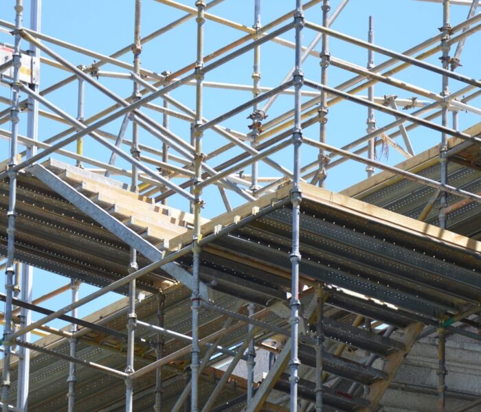 Cuplock scaffolding components shown on Bladez steel scaffolding at a Pune construction site